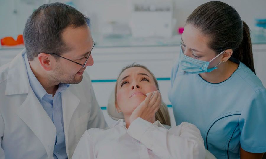 Woman-With-Dental-Abscess-Getting-Checked-By-Dentist