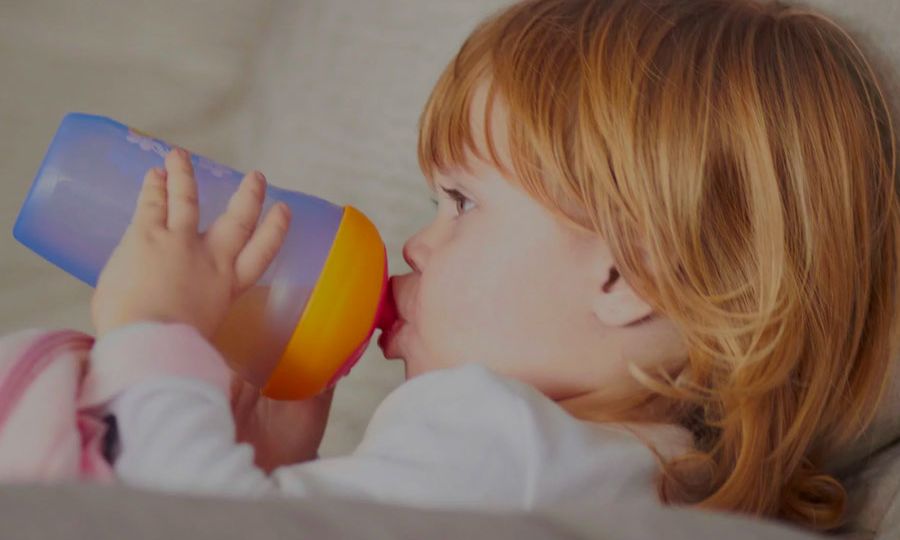 Toddler-Drinking-From-Sippy-Cup-Causing-Tooth-Decay