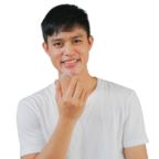 Close,Up,Young,Asian,Man,Smiling,With,Hand,Holding,Dental